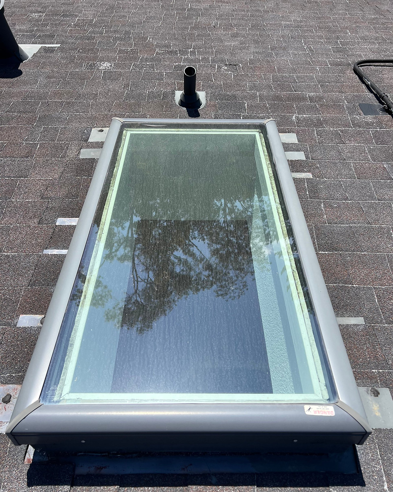 Skylight, cleaned from the roof, before cleaning
